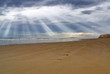 sun beam over the deserted beach sun beam over the deserted beach