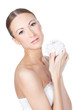 Young beautiful woman holding flower in her hands