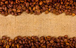 Coffee grains on the burlap background