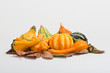 ornamental gourds on autumn leaves