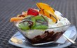 Coupe with chocolate ice, fruit and whipped cream Coupe with chocolate ice, fruit and whipped cream