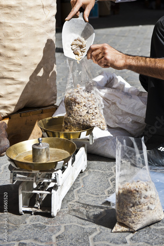 Photo: Vendor weighing bakhoor Vendor weighing bakhoor