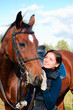 portrait of young beautiful woman with horse