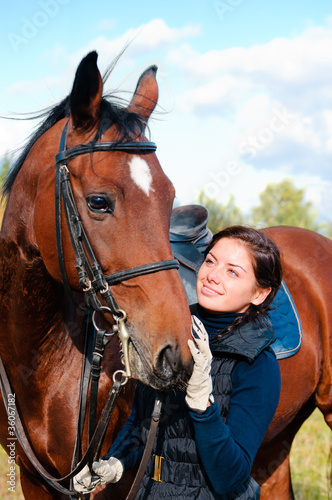 Photo: portrait of young beautiful woman with horse portrait of young beautiful woman with horse