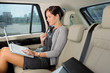 Executive businesswoman work laptop car backseat