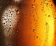 Texture of water drops on the bottle of beer.