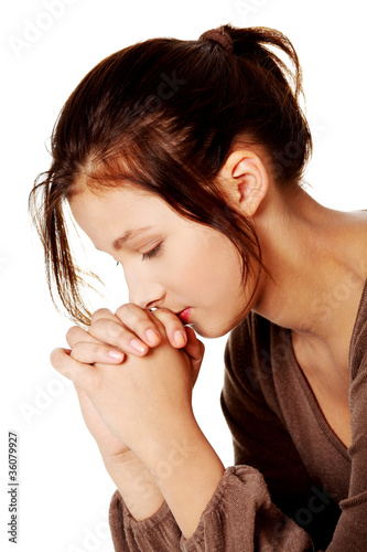 Photo: Pretty girl praying. Pretty girl praying.