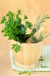 herbs in wooden mortar with pestle