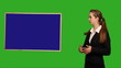 Video: Business woman showing something on green screen Business woman showing something on green screen