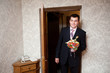 groom with a bouquet