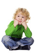 Foto: Dreamy boy sitting on a floor Dreamy boy sitting on a floor