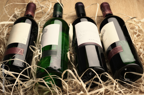 Photo: Wine bottles in straw Wine bottles in straw