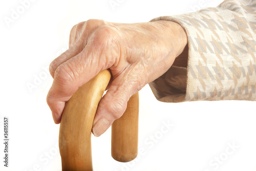 Photo: Old Lady's hand with walking stick Old Lady's hand with walking stick