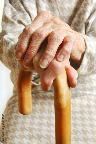 Photo: Old Lady's hands with walking stick Old Lady's hands with walking stick