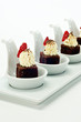Chocolate brownie Dessert on white porcelain tasting spoons