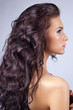 Young woman with long shiny hair isolated