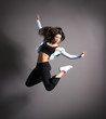 Young and sexy modern dancer over grey background Young and sexy modern dancer over grey background