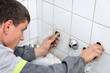 Plumber checking water pipe Plumber checking water pipe