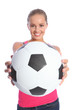 Beautiful smiling teenage girl with soccer ball