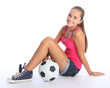 Beautiful teenage student girl with soccer ball