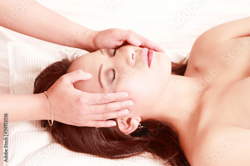 Photo: Hands massaging woman's face in spa theme image Hands massaging woman's face in spa theme image