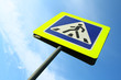 Image of pedestrian crossing sign against sky