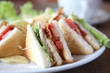 Club sandwich with coffee on wood background Club sandwich with coffee on wood background
