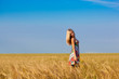 woman walking on wheat field