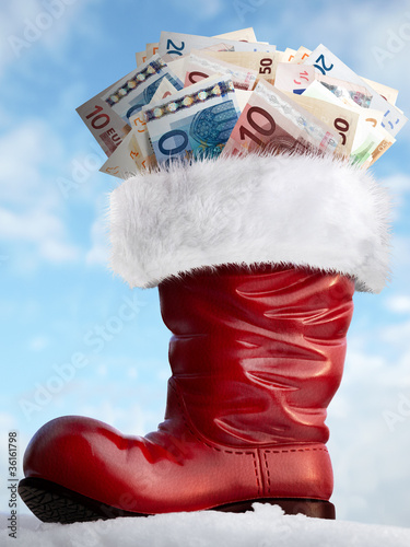 Photo: Nicholas boot with money in front of blue sky Nicholas boot with money in front of blue sky
