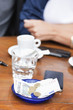 Photo: Euro banknotes and coins with bill on a table in a restaurant, Paris, Ile-de-France, France Euro banknotes and coins with bill on a table in a restaurant, Paris, Ile-de-France, France