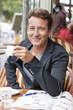 Man drinking coffee in a restaurant, Paris, Ile-de-France, France