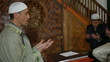 Mullah praying  in  mosque