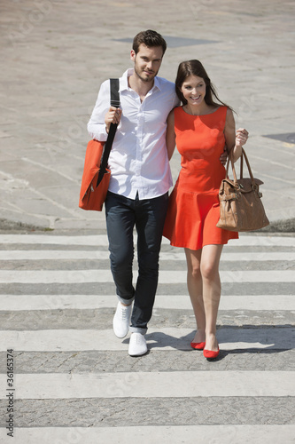 Photo: Couple on a crosswalk, Paris, Ile-de-France, France Couple on a crosswalk, Paris, Ile-de-France, France