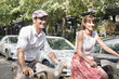 Photo: Couple riding bicycles, Paris, Ile-de-France, France Couple riding bicycles, Paris, Ile-de-France, France