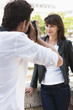 Photo: Man taking a picture of a woman with a camera, Seine River, Paris, Ile-de-France, France Man taking a picture of a woman with a camera, Seine River, Paris, Ile-de-France, France