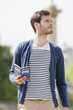 Photo: Man holding a travel guidebook, Paris, Ile-de-France, France Man holding a travel guidebook, Paris, Ile-de-France, France