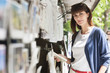 Woman holding a book at a book stall, Paris, Ile-de-France, France