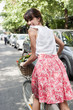 Photo: Woman carrying vegetables on a bicycle, Paris, Ile-de-France, France Woman carrying vegetables on a bicycle, Paris, Ile-de-France, France
