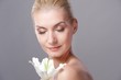 Beautiful blond woman with white lily flower Beautiful blond woman with white lily flower