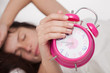 beautiful woman  and alarm clock
