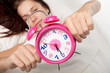 beautiful woman  and alarm clock