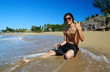 Photo: Man with water on tropical beach Man with water on tropical beach