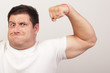 Image of a funny man flexing his arm Image of a funny man flexing his arm