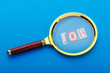 Unemployment concept with magnifying glass