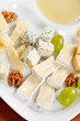 Cheese plate with grapes and honey