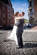 young bride jumping on groom and kissing him young bride jumping on groom and kissing him
