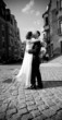 Black and white photo ofnewly married couple kiss Black and white photo ofnewly married couple kiss