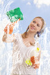 young woman washing window