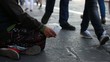 Woman homeless in city begging