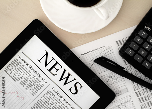 Photo: Tablet PC With News On Desk Tablet PC With News On Desk